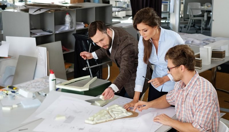 confident team of engineers working together in a pfw37d2 min.jpg confident team of engineers working together in a pfw37d2 min.jpg